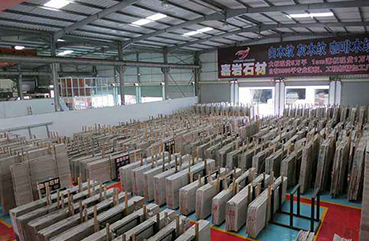 Joyace Stone settles in Fujian Shuitou Zhongmin Stone Mall and establishes the first super large-scale wooden grain marble store in Fujian Province.